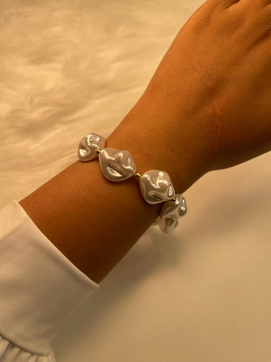 Pearl Silver bracelet on a wrist with a neutral background